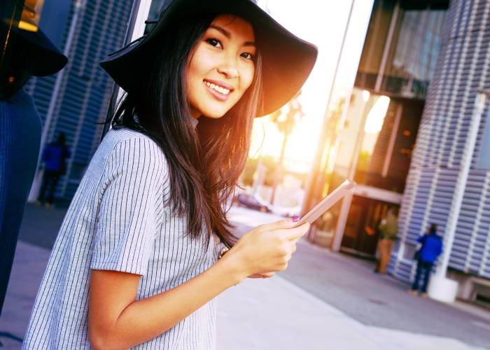 asian woman with smartphone